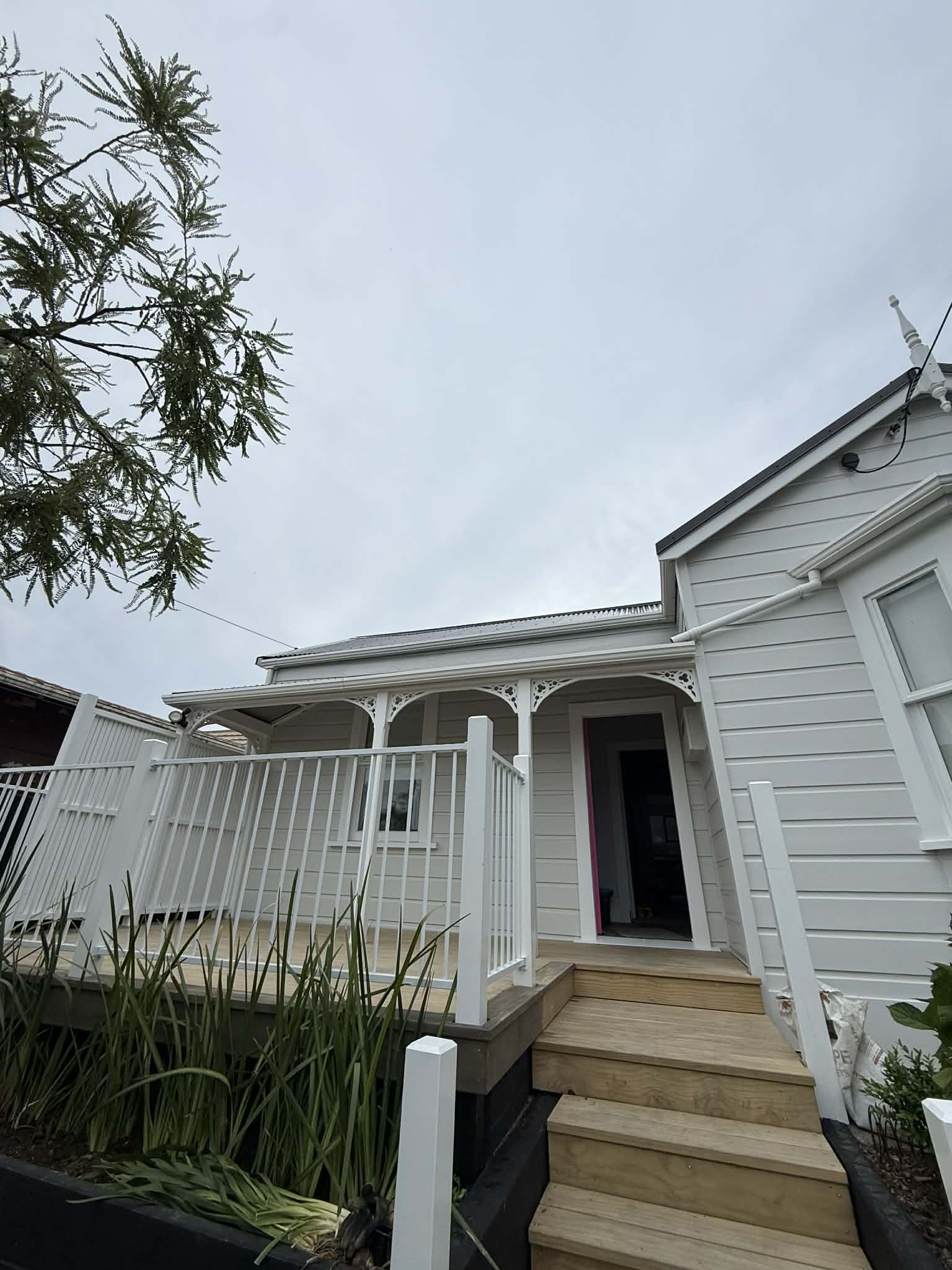 White villa exterior painting with freshly painted verandah — Renoval Pro NZ Wellington